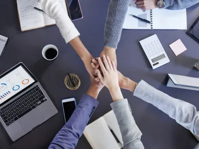 Youve got my vote. Shot of a group of unrecognizable businesspeople stacking their hands at work.